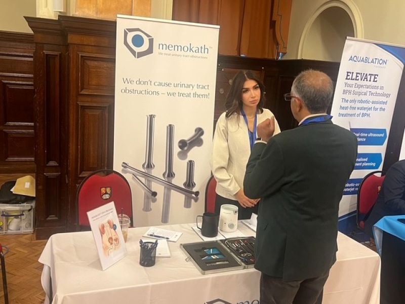 Pnn Medical booth at BAUS 2025 with Perihan speaking to a visitor